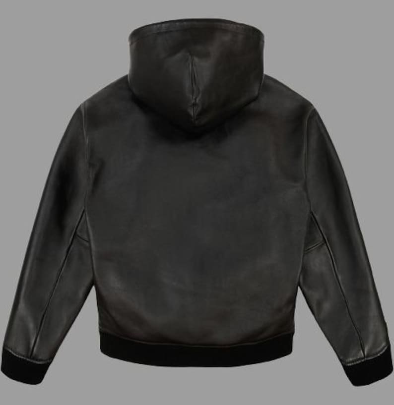 May include: Black leather hooded jacket with a black ribbed hem and cuffs. The jacket has a full-length zipper and a hood. The jacket is made of a smooth, supple leather material.