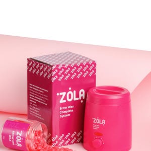 May include: A complete brow wax system by ZOLA, featuring a pink wax warmer, a box, and a jar of pink wax beads. The box reads "Brow Wax Complete System". The jar of wax beads is labeled "Brow Epil Wax".