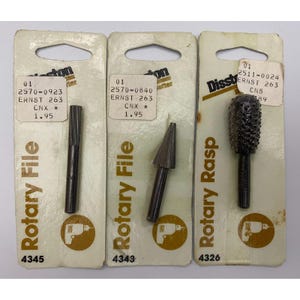 May include: Three Disston brand rotary tools on individual cardboard backing cards. Two are cylindrical and conical rotary files, and one is a textured rotary rasp. Each card features the product name, model numbers, and a drill icon graphic.