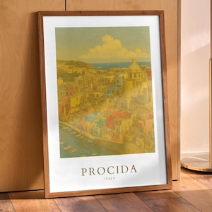 May include: A framed art print featuring a vintage-style illustration of Procida, Italy. The artwork depicts a colorful coastal town with buildings in shades of yellow, red, and blue, under a blue sky with fluffy clouds. The print is in a wooden frame.