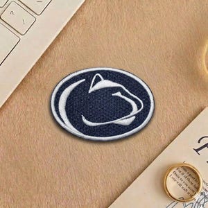 May include: A set of three ceramic mugs with a speckled, matte finish. The mugs are in shades of cream, light gray, and dark gray. Each mug has a simple, minimalist design, perfect for coffee or tea.