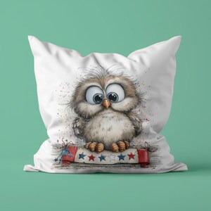 May include: White cushion featuring a cartoon owl illustration with large eyes. The owl sits on a banner with red, white, and blue stars and stripes. A decorative item for the home.