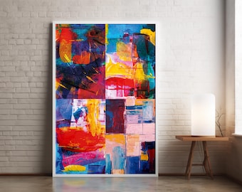 May include: Abstract art print with a white frame. The artwork features a vibrant mix of colors, including red, blue, yellow, and purple, arranged in a patchwork design. The painting is displayed against a white brick wall.