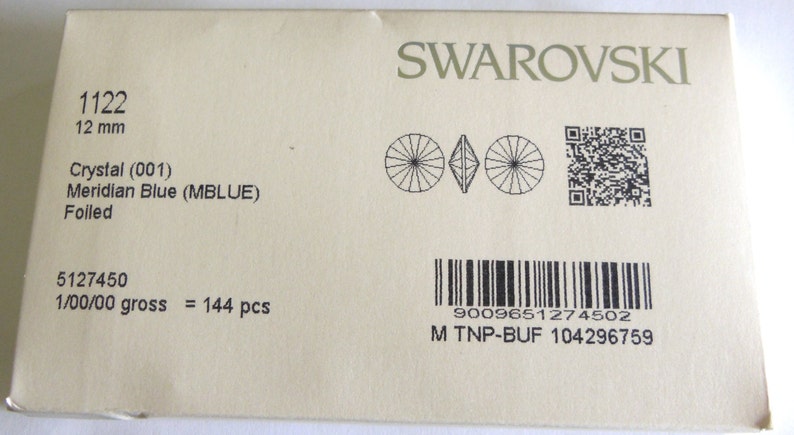 May include: A package of 144 Swarovski crystal rhinestones in Meridian Blue, size 1122 (12 mm). The package includes a barcode, a QR code, and the text "5127450 1/00/00 gross = 144 pcs 9009651274502 M TNP-BUF 104296759".