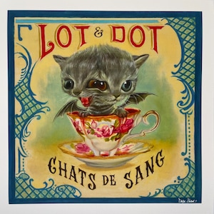 May include: A vintage-style illustration of a two-headed cat with bat wings sitting in a teacup. The text "Lot & Dot Chats de Sang" is written on the image.