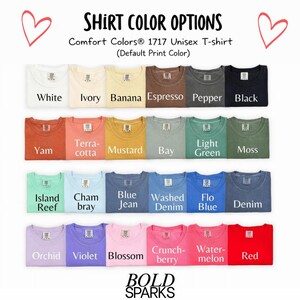 May include: A display of Comfort Colors 1717 Unisex T-shirts in various colors, including white, ivory, banana, espresso, pepper, black, yam, terracotta, mustard, bay, light green, moss, island reef, chambray, blue jean, washed denim, flo blue, denim, orchid, violet, blossom, crunchberry, watermelon, and red. The text "SHIRT COLOR OPTIONS" is at the top.