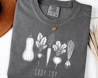 Camiseta corta Comfort Colors® con divertido juego de palabras sobre jardinería y arte vegetal, regalo ideal para amantes de las plantas, camiseta gráfica con humor vegetal.