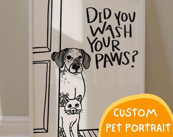 May include: A framed wall art print featuring a black and white line drawing of a dog and a cat standing by a door. The text reads, Did you wash your paws? The dog is spotted and the cat is white. The artwork is presented in a white frame.