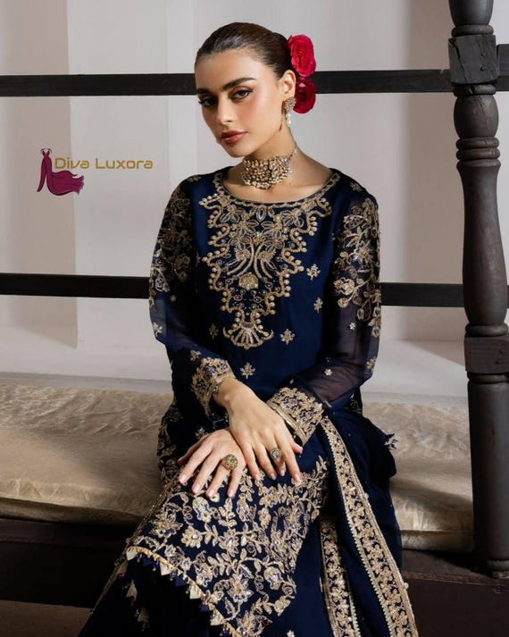 blue and gold anarkali dress Make your wedding look unforgettable with the Zivara Blue Wedding Wear  Embroidered Anarkali Suit Set  A graceful blend of tradition and modern  royal charm  Designed with intricate embroidery and flowing