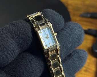 Women’s Bulova Gold Band with Diamond Accent Mother of Pearl dial