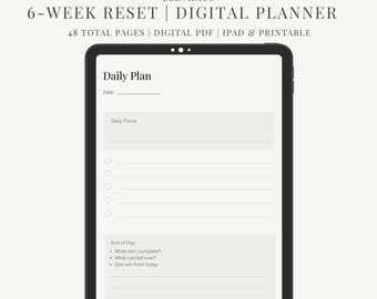 May include: A digital planner displayed on a tablet. The screen shows a daily plan template with sections for date, daily focus, and end-of-day reflections. Text at the top reads "6-WEEK RESET | DIGITAL PLANNER".