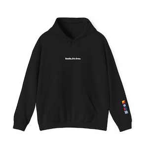 May include: Black hoodie with a drawstring hood and a front kangaroo pocket. The text "Smile, it's free." is printed in white on the chest. The left sleeve features colorful nautical flags. A casual, comfortable garment.