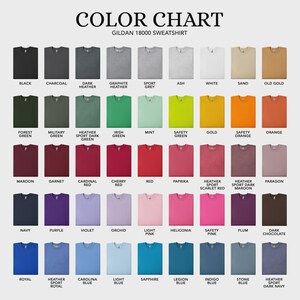 May include: Color chart of Gildan 18000 sweatshirts in various colors, including black, charcoal, navy, and red. The chart displays a wide range of hues, from dark to light, with names like "Safety Pink" and "Heather Sport Dark Navy."