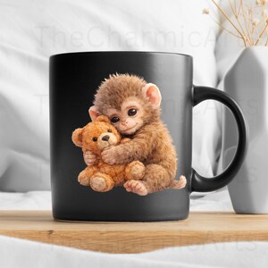 May include: A black ceramic mug featuring a brown monkey hugging a brown teddy bear. The monkey has a sweet expression, and the teddy bear has a classic design. The mug has a black handle and is likely for beverages.