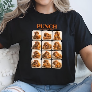 May include: Black t-shirt with the word "PUNCH" in orange, above a grid of monkey illustrations holding teddy bears. The text "Play Hard, Love Harder" is below the word "PUNCH".