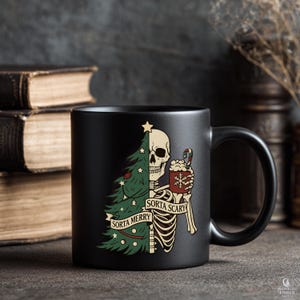 May include: Black ceramic mug with a humorous holiday design. The design features a skeleton holding a mug of hot cocoa and a Christmas tree, with the text "Sorta Merry" and "Sorta Scary".