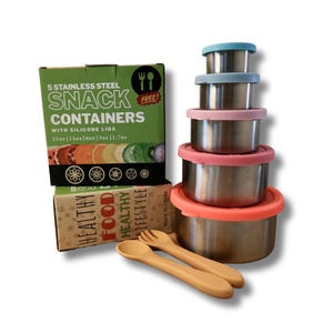 May include: A set of five stainless steel snack containers with colorful silicone lids. The containers are stacked next to a box that reads "5 Stainless Steel Snack Containers with Silicone Lids". Also included are a fork and spoon.