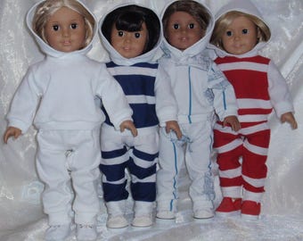 May include: Four dolls wearing white hooded sweatshirts and matching pants. The dolls are wearing different colored stripes on their pants: white and blue, white and red, and white and black.