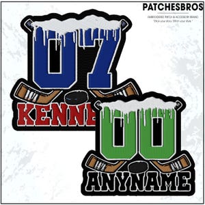 May include: Embroidered patches featuring hockey-themed designs. One patch displays the number "07" in blue with "KENNEDY" below, and the other shows "00" in green with "ANYNAME" underneath. Both include hockey sticks, a puck, and white accents.