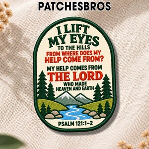 May include: An oval embroidered patch with a dark green border on a cream background. It features the text I LIFT MY EYES TO THE HILLS FROM WHERE DOES MY HELP COME FROM? MY HELP COMES FROM THE LORD WHO MADE HEAVEN AND EARTH PSALM 121:1-2.