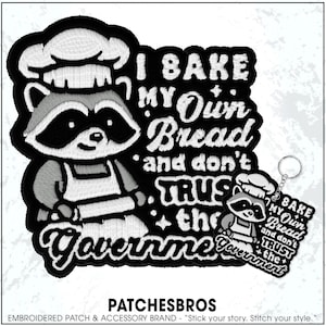 May include: Embroidered patch featuring a raccoon chef with the text "I BAKE MY Own Bread and don't TRUST the Government." A matching keychain is also visible. The patch is black and white.