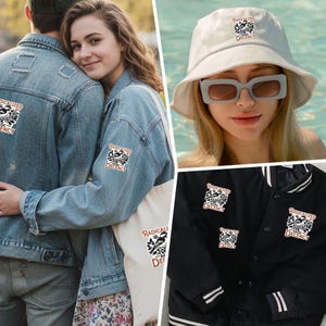 May include: A square sticker featuring a black and white bird illustration surrounded by floral motifs and the text Radicalized by Decency. The design is shown applied to a denim jacket, a canvas tote bag, a white bucket hat, and a black varsity jacket.