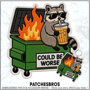 May include: An embroidered patch and matching keychain featuring a raccoon wearing black sunglasses, sitting on a green dumpster with a fire inside. The dumpster has a white sign with the black text COULD BE WORSE. The raccoon holds a drink.