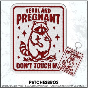 May include: Embroidered patch and keychain set with a raccoon illustration. The patch and keychain feature the text "FERAL AND PREGNANT DON'T TOUCH ME" in red on a white background. The brand name "PATCHESBROS" is at the bottom.