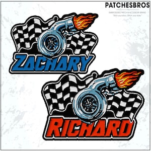 May include: Embroidered patches featuring a turbocharger design with a checkered flag background. The top patch has the name "ZACHARY" in blue, and the bottom patch has the name "RICHARD" in red. The patches are from PATCHESBROS.