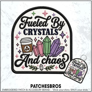 May include: An embroidered patch and a matching keychain featuring the text "Fueled By CRYSTALS And chaos" in black script and block lettering. The design includes a brown coffee cup, pink, green, and purple crystals, and small stars.