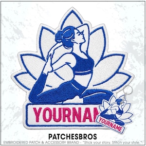 May include: An embroidered patch and a matching keychain featuring a blue and white design of a person in a yoga pose centered in front of a lotus flower. The rectangular base of the design includes the pink text YOURNAME in capital letters.
