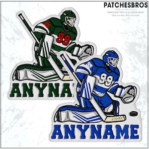 May include: Embroidered hockey goalie patches in green and blue, each with the number 99. The patches feature the text "ANYNAME" and "ANYNA" in white letters. The patches are from the brand "PATCHESBROS".