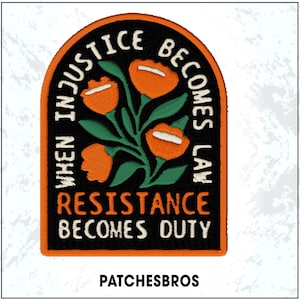 May include: Embroidered patch with a black background and an orange border. The patch features orange flowers with white accents and green leaves. Text in white reads "WHEN INJUSTICE BECOMES LAW RESISTANCE BECOMES DUTY." The brand name "PATCHESBROS" is at the bottom.