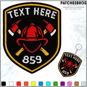 May include: Black and yellow embroidered patch with the text "TEXT HERE" and the number "859". The patch features a red firefighter helmet and crossed axes. A matching keychain is also shown.