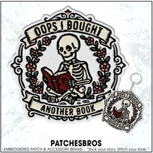 May include: Embroidered patch and keychain set featuring a skeleton reading a book. The patch and keychain have the text "OOPS I BOUGHT ANOTHER BOOK" in a banner. The design includes a floral wreath and is in black, white, and red.