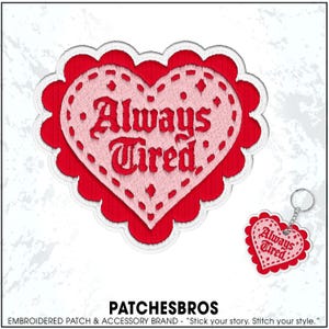 May include: Embroidered heart-shaped patch and keychain with the words "Always Tired" in a decorative font. The patch and keychain are red and pink with a scalloped edge. The brand name "PATCHESBROS" is at the bottom.