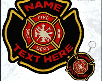 May include: Black and red embroidered firefighter patch with gold trim, featuring the text "NAME", "FIRE", "DEPT", and "TEXT HERE". A matching keychain is also included. The patch has a Maltese cross design.