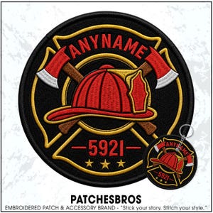 May include: A circular embroidered patch and a matching keychain featuring a red firefighter helmet centered over two crossed axes. The design includes the text ANYNAME in red, the number 5921, and three gold stars on a black background with gold trim.