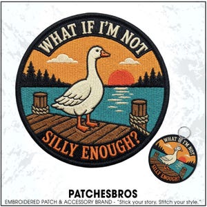 May include: A circular embroidered patch and a matching keychain featuring a white goose standing on a wooden dock at sunset. The scene includes a blue lake, dark pine trees, and an orange sun. The text WHAT IF I'M NOT SILLY ENOUGH? is stitched in orange.