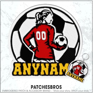 May include: Embroidered patch featuring a soccer player in a red jersey with the number "00" on the back, set against a black and white soccer ball. The word "ANYNAME" is in yellow. A keychain with the same design is also visible.