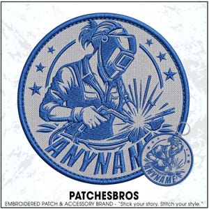May include: A circular embroidered patch and a matching circular keychain featuring a blue and light gray design of a welder wearing a protective helmet and holding a welding torch. The text ANYNAME is stitched in blue at the bottom of both items.