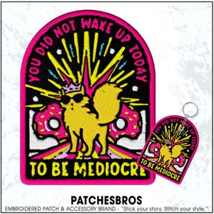May include: Embroidered patch and keychain set with a yellow cartoon character wearing sunglasses and a crown, surrounded by a burst of yellow and pink. The text reads "YOU DID NOT WAKE UP TODAY TO BE MEDIOCRE."