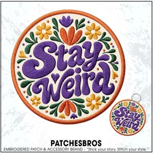 May include: A circular embroidered patch and a matching circular keychain featuring the text Stay Weird in purple script. The design includes orange and yellow flowers, green leaves, and small hearts on a cream background with an orange border.