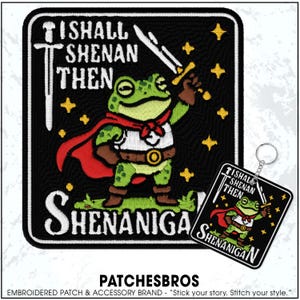 May include: Embroidered patch featuring a green frog character in a red cape and holding a sword, with the text "I Shall Then Shenanigan" on a black background. A matching keychain is also visible.