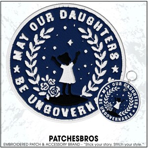 May include: Embroidered patch and keychain set. The navy blue patch features white text that reads "May Our Daughters Be Ungovernable" around a silhouette of a girl. The keychain has the same design.
