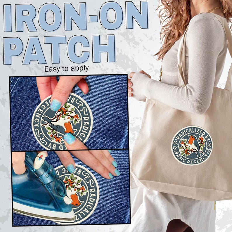 May include: A circular iron-on patch featuring a robin perched on a branch with berries, surrounded by the text "RADICALIZED BY BASIC DECENCY". The patch is shown applied to a blue denim fabric and a beige canvas tote bag, with an iron visible.