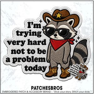May include: An embroidered patch featuring a raccoon wearing a brown cowboy hat, black sunglasses, and a red bandana, standing in brown cowboy boots. The text reads, I'm trying very hard not to be a problem today. A matching keychain is also shown.