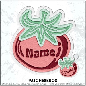 May include: An embroidered patch and a matching keychain, both shaped like a tomato with a light green stem and a pink body featuring the word Name in dark red embroidery. The designs have a white border and a textured, stitched appearance.