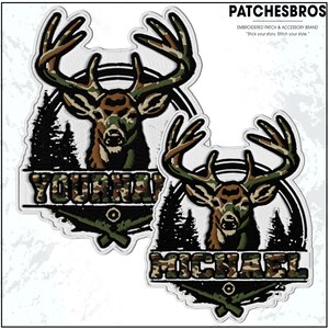 May include: Embroidered patch featuring a deer head with large antlers, in camouflage colors. The patch includes the text "YOUR NAME!" in a matching camouflage font, set against a forest silhouette and crossed rifles. The brand name "PATCHESBROS" is at the top.