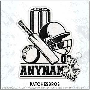 May include: A black and white embroidered patch and matching keychain featuring a cricket theme. The design includes a cricket bat, a ball, a helmet, and wickets. The text ANYNAME is prominently displayed in a bold, sans-serif font below the equipment.